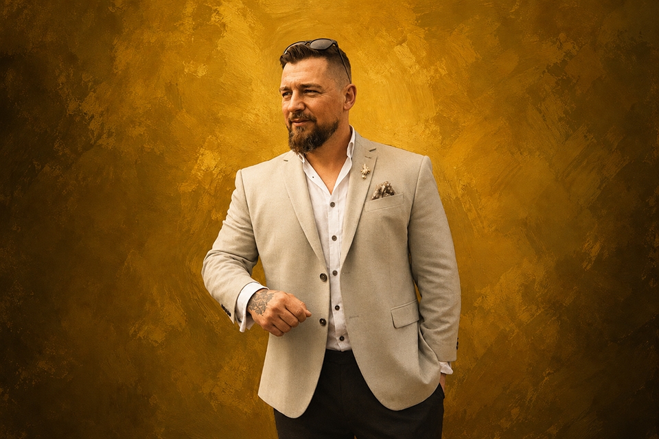 Alt text: Portrait of Kevin Potter, Oxfordshire wedding photographer, smiling and looking to camera, representing a relaxed, confident and approachable presence on a wedding day.